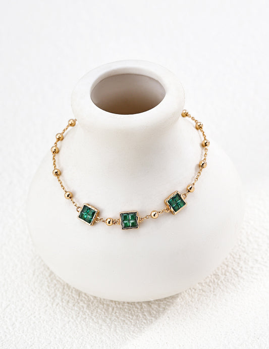 Simple gold bracelet with a square design and sparkling zirconia