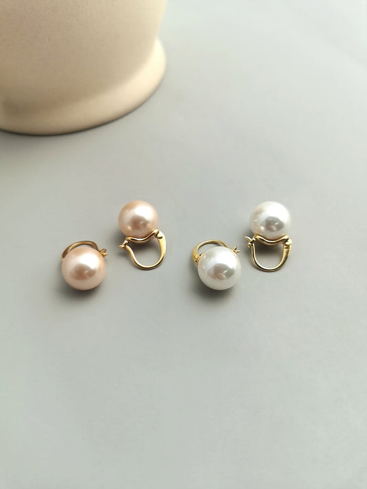 Large Shell Pearl Stud Earrings: For an elegant and impactful look