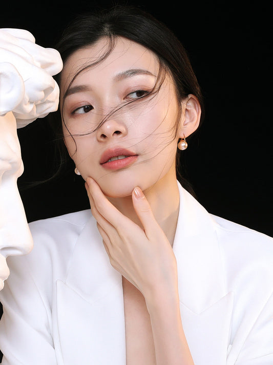 Large Shell Pearl Stud Earrings: For an elegant and impactful look